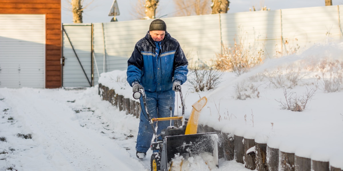 Snow removal — plowing a residential driveway